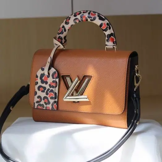 Buy Louis Vuitton Twist Lock Brown Handbag - Online