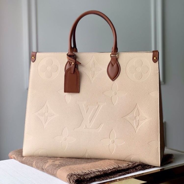 Louis Vuitton Beige Embossed on the Go MM Bag