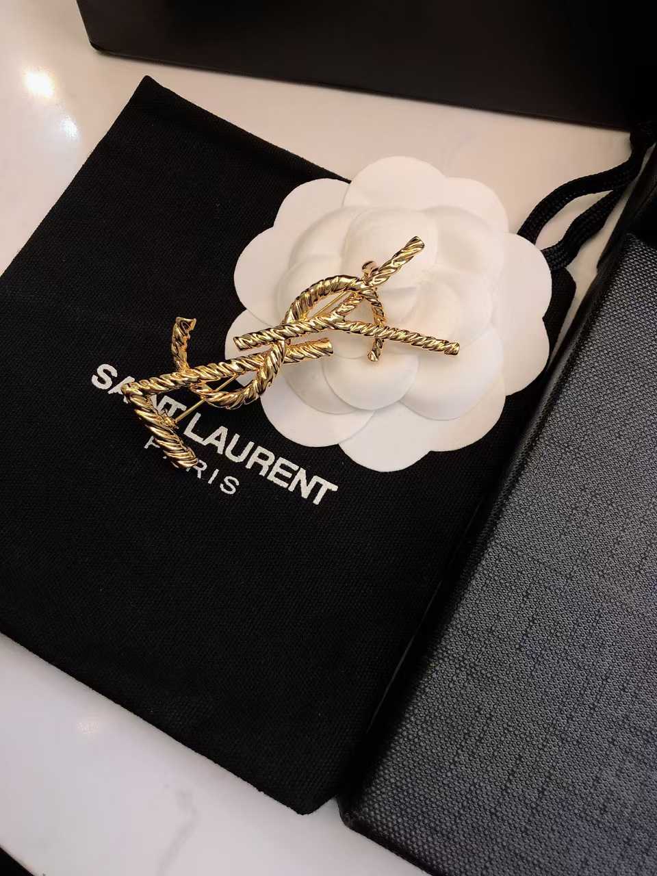 WhatsApp Image 2025-03-07 at 5.53.30 PM YSL Golden Spiral Logo Brooch