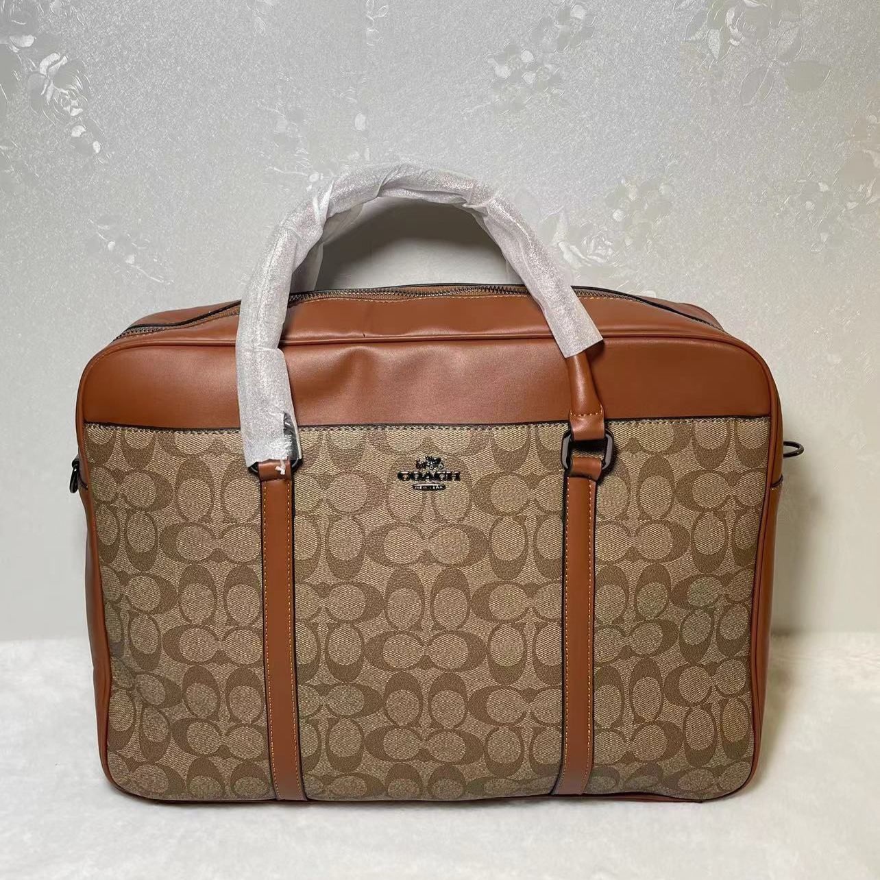 WhatsApp Image 2025-09-20 at 8.57.44 PM Coach Signature Apricot Brown Laptop Bag