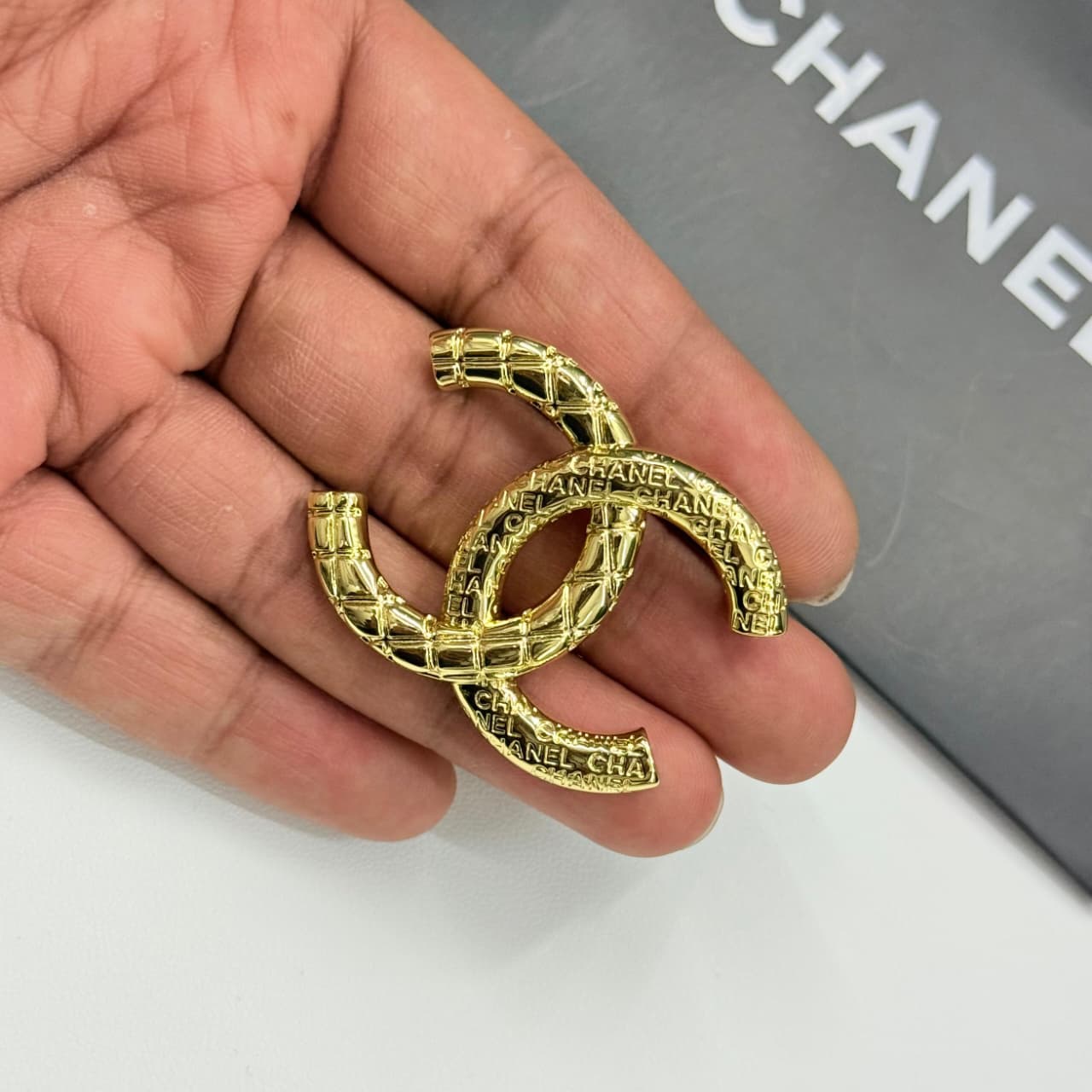 WhatsApp Image 2025-10-01 at 2.38.34 PM (1) Chanel CC Logo With Quilted Engraving Brooch