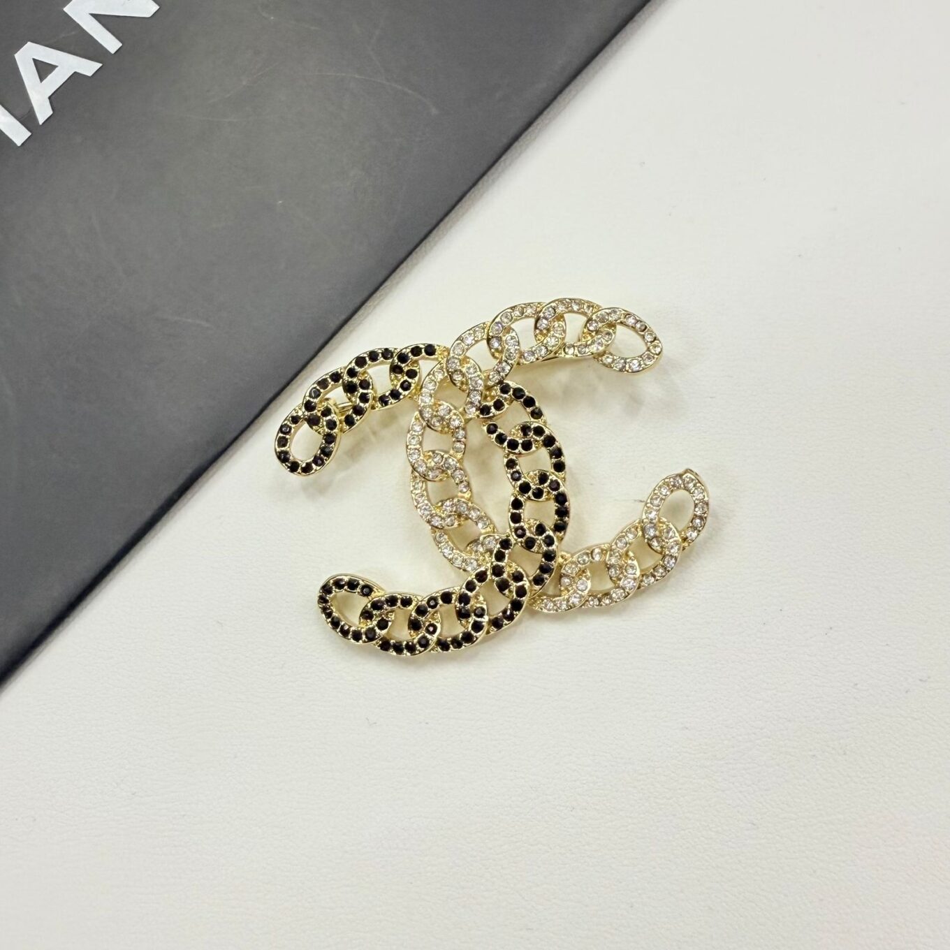 WhatsApp Image 2025-10-01 at 2.41.41 PM (1) Chanel CC Logo With Black And White Crystal Brooch
