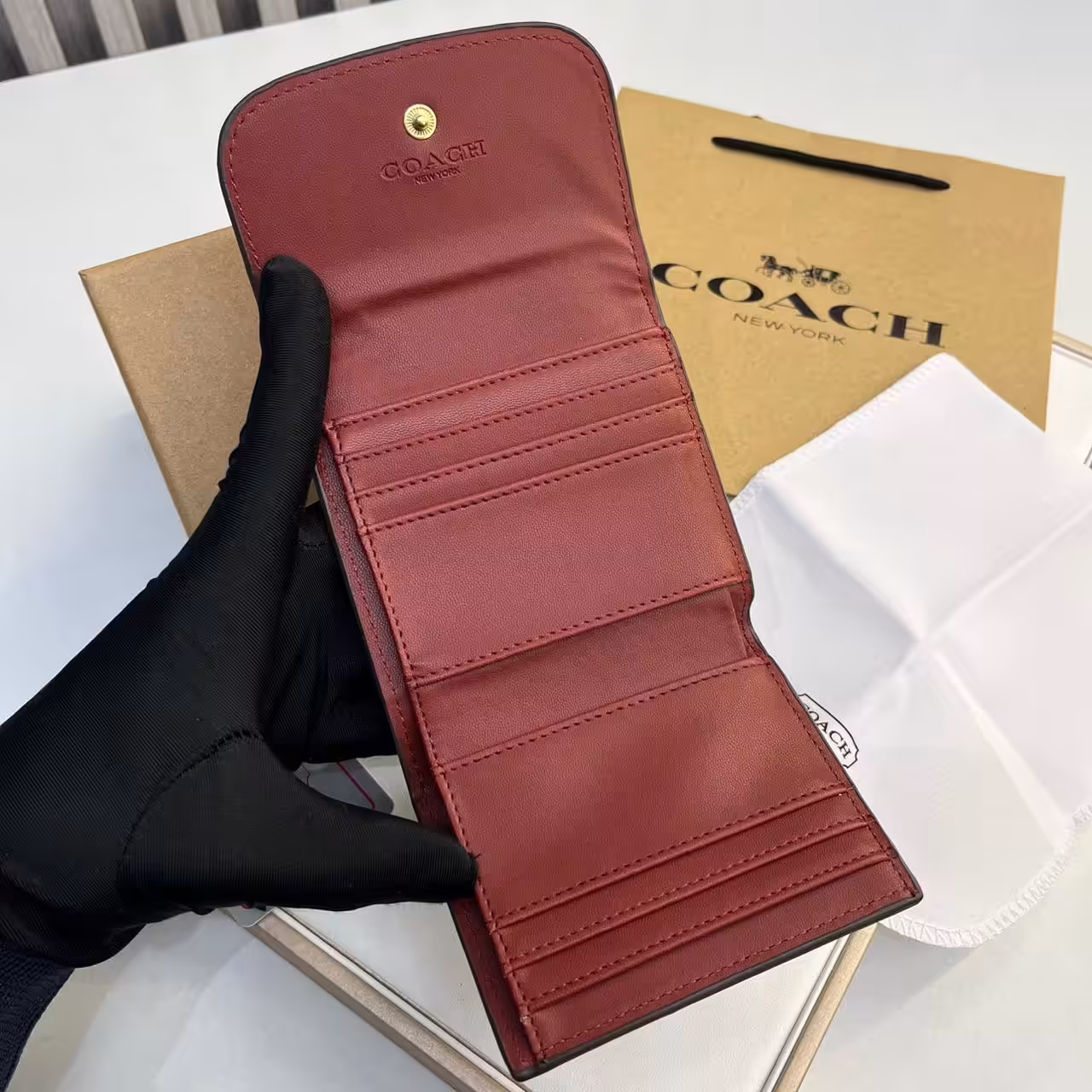 WhatsApp Image 2025-12-02 at 6.44.51 PM (3) Coach three Fold Apricot Rose Pink Wallet