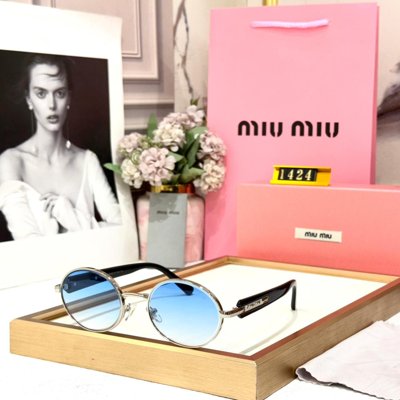 Miu Miu Silver Round Blue Sunglasses for Women