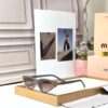 Miu Miu Dark Gray Cat Eye Women’s Sunglass